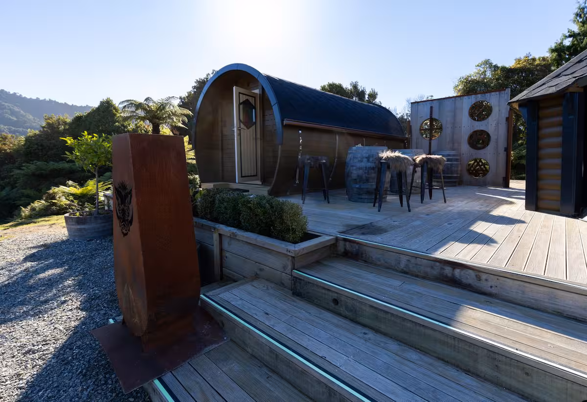 Detail of the Odin barrel cabin interior with warm timber lining and cosy furnishings