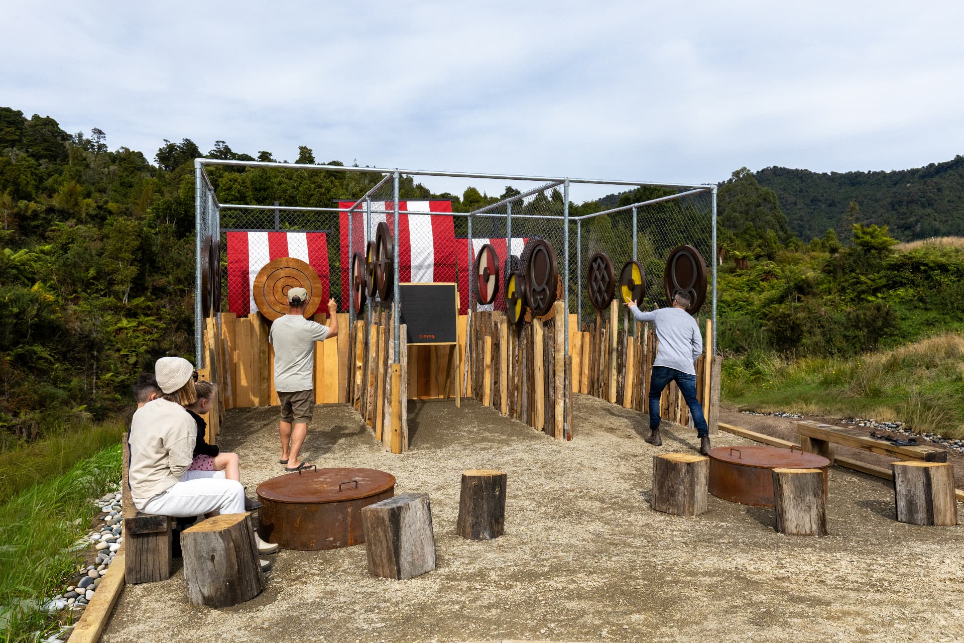 Axe embedded in a timber round target at the outdoor axe throwing range