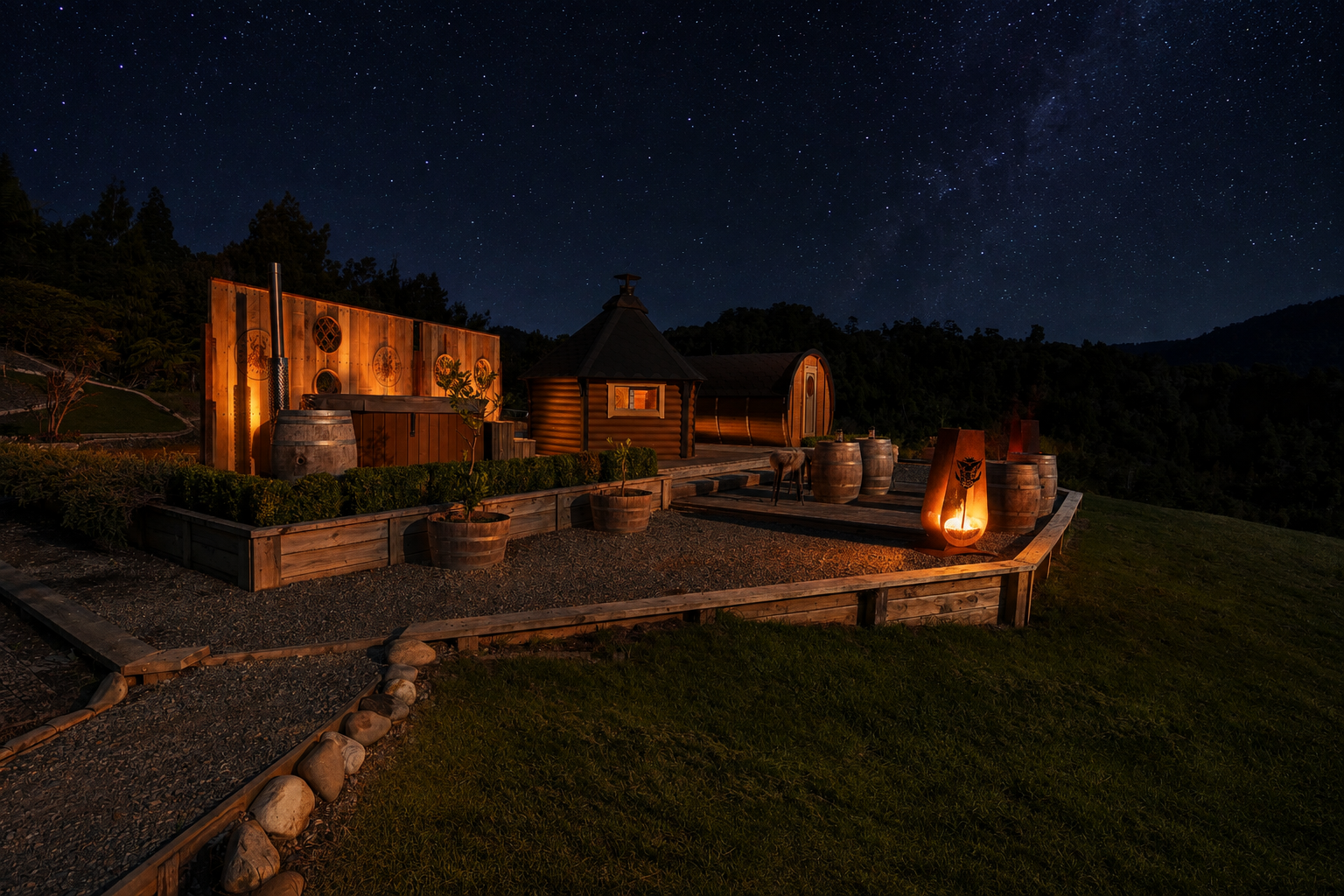 Viking Village barrel cabins, axe throwing range and fire pit glowing beneath a starlit West Coast night sky